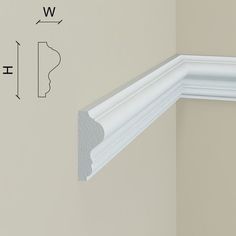 an image of the corner of a wall that is painted white and has measurements for it