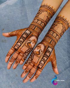 two hands with henna designs on them