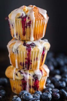 three blueberry muffins stacked on top of each other