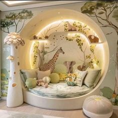 a child's bedroom with a circular bed and stuffed animals on the wall behind it