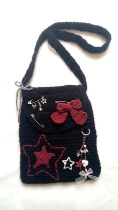 a black purse with red and white stars on it