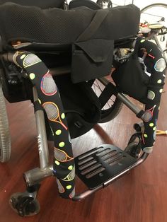 a wheelchair seat with tennis rackets on it