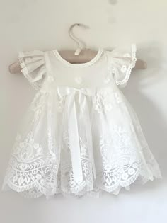 Beautiful and elegant baby girls' lace baptism dress. Two-piece set including a delicately embroidered cap-sleeve gown with matching lace bonnet. Complete with a linen and cotton blend liner, to ensure comfort. Feel free to add one of our adorable headbands to complete the look. Baptism Dress Baby, Baby Blessing Dress, Sewing Machine Patterns, Blessing Gown, Girls Cap, Baby Lace Dress, Baby Baptism Dress, Girls Baptism Dress