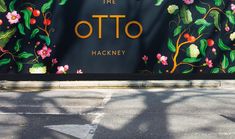 the entrance to the otto hakkaney store is painted with flowers and leaves