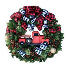 a christmas wreath with a red truck on it