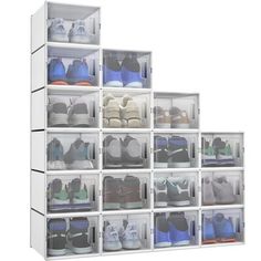 a white shelf filled with lots of shoes