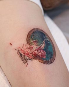 a woman's arm with a tattoo on it that has an image of a ballerina