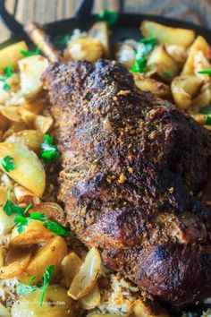 a close up of a plate of food with meat and potatoes