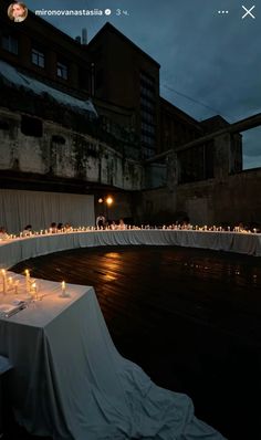 an empty table is set up with lit candles