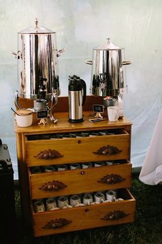 an old dresser with two pots and pans on it