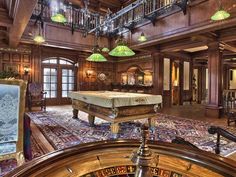 a large room with a pool table in it