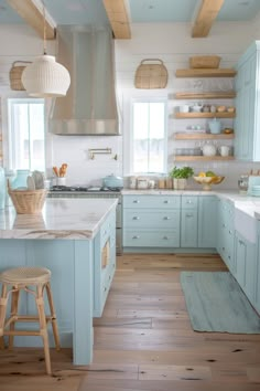 These coastal kitchens are designed to evoke a sense of relaxationThey feature airy color palettesnatural texturesand organic elements. Sand Color Cabinets Kitchens, Beach Houses Interiors, Coastal White Kitchen Ideas, Coastal Kitchen Paint Colors, Beach Decor Kitchen, Blue And White House, Coastal Boho Kitchen, Beach Cottage Kitchen, Beachy Home Decor