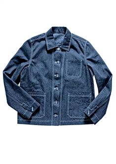 a denim jacket with buttons on the front and back, sitting against a white background