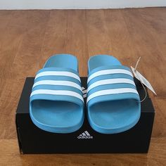 Denim Blue Colored Adidas Sandals. Size 7 Women, Would Fit Someone Who Wears A Size 8 Regularly In Women Shoes. Color Is A Bit Brighter In The Pictures. It Is Really More Of A Blue Jean Color. Casual Blue Slippers For Beach, Adidas Sandals Women, Adidas Casual Slides For Spring, Adidas Casual Open Toe Slides, Casual Adidas Open Toe Slides, Comfortable Blue Slides For Summer, Casual Blue Flat Slippers, Blue Slides With Cushioned Footbed For Summer, Casual Blue Flip Flops With Cushioned Footbed