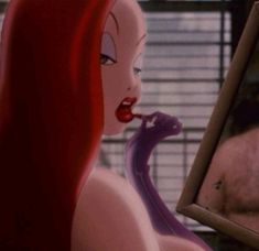 ariel from the little mermaid looking at herself in mirror with man behind her and woman standing next to her