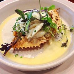 a white plate topped with food on top of a table