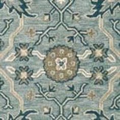 a blue rug with an ornate design on it