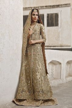 Buy Pakistani Bridal Wear - Bridal Bridal Dress - Pakistani Bridal Dresses With Embroidered Work of Zardozi, Sequins And Resham in USA, UK, Canada, Australia Visit Now : www.NameerabyFarooq.com or Call / Whatsapp : +1 732-910-5427 Designer Gold Raw Silk Lehenga, Designer Raw Silk Gold Dupatta, Naqshi Embellished Shantoon Anarkali Set For Wedding, Gold Lehenga With Dupatta In Raw Silk, Gold Raw Silk Lehenga With Dupatta, Gold Raw Silk Lehenga With Zari Work, Gold Anarkali Style Designer Sharara, Gold Anarkali Choli In Raw Silk, Bollywood Style Gold Raw Silk Sharara