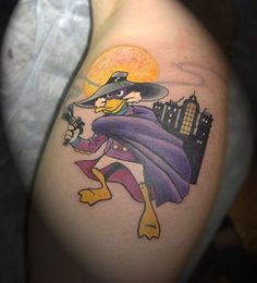 a cartoon character tattoo on the arm