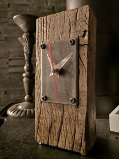 a clock made out of wood on a table