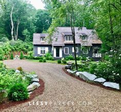 a large house surrounded by trees and bushes