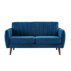 a blue couch sitting on top of a white floor