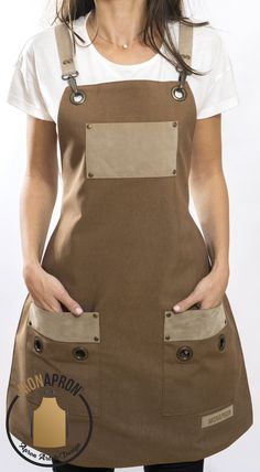 a woman is wearing an apron and has her hands on her hips