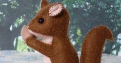 a stuffed squirrel is standing on its hind legs