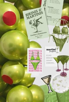 an assortment of green and red items on display in a store window, including martini glasses