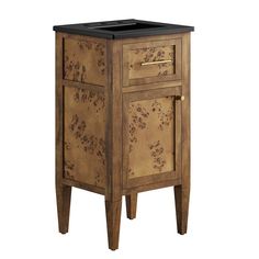 an old wooden cabinet with black top and drawers on legs, isolated against a white background