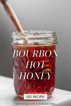 a jar filled with honey sitting on top of a table