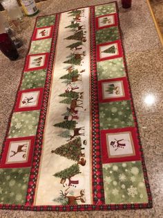 a table runner with christmas decorations on it