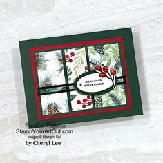 a close up of a card with pine cones and berries on it, in front of a white background