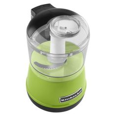 a green and black food processor on a white background