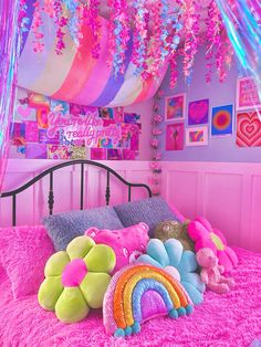 a bed with pink and purple decorations on it