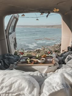 a tray with food on it sitting in the back of a truck next to an open window