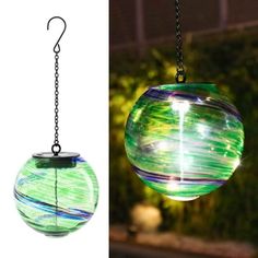 two different colored glass balls hanging from chains