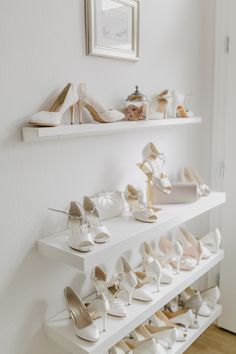 there are many pairs of shoes on the shelves