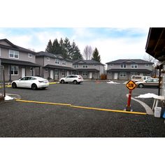 several cars parked in an empty parking lot