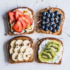 four slices of toast with fruit on them