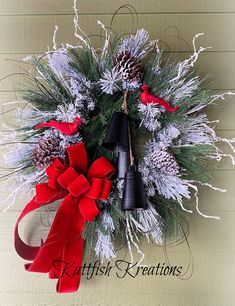 a christmas wreath with bells and pine cones