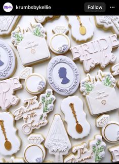 the cookies are decorated with white and gold icing, which include silhouettes of bride and groom