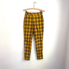 Vintage Hot Topic Yellow and Black Plaid Pants. Clueless Style. Skinny Fit. High-Waisted Pants. Pockets. Grunge Style. Emo. Y2K. 2000s. Really great condition. Stretchy. Accessories (unless otherwise stated): n/a Approx. Measurements: - 26"-30" waist - 42" hips - 11" rise - 28" inseam For exact / add'l measurements, please DM us. 🙂 Vintage and pre-owned items may show signs of  imperfection and/or usage, see pics.  Sold as is. Shipping UPDATE:  - please see shipping times for estimated ship/delivery times.  - your patience is appreciated, thanks. Domestic SHIPPING:  - as usual, we ship very fast and very efficient.  - we may use recycled packages / packaging   - helps alleviate shipping costs   - environment friendly INT'L SHIPPING:  - we happily ship to overseas clients  - contact us for Vintage Hot Topic, Clueless Style, Black Plaid Pants, Clueless Fashion, Emo Y2k, Plaid Pants, Yellow And Black, Environment Friendly, Grunge Style