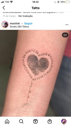 a tattoo on someone's arm that has a fingerprint in the shape of a heart