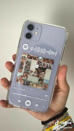 a person holding up a cell phone case with pictures on the front and back cover