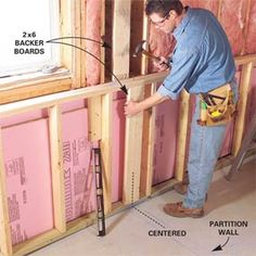 a man is working on the insulation in his home's walls and flooring