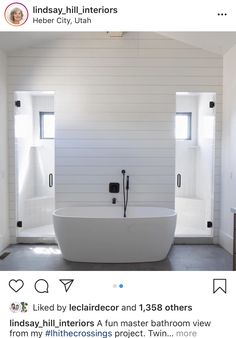 a white bath tub sitting inside of a bathroom