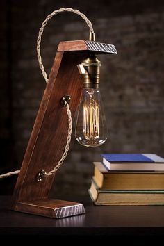 a lamp that is on top of some books