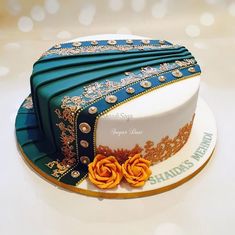 there is a cake that has been decorated with blue and gold