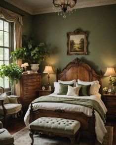 a bedroom with green walls and white bedding